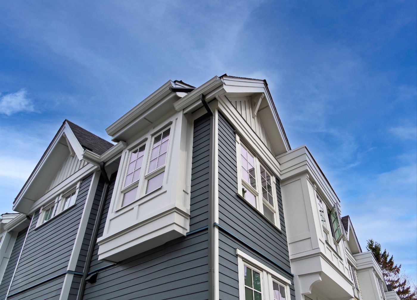 Second-storey addition with bay window and new siding, Glen Cove NY