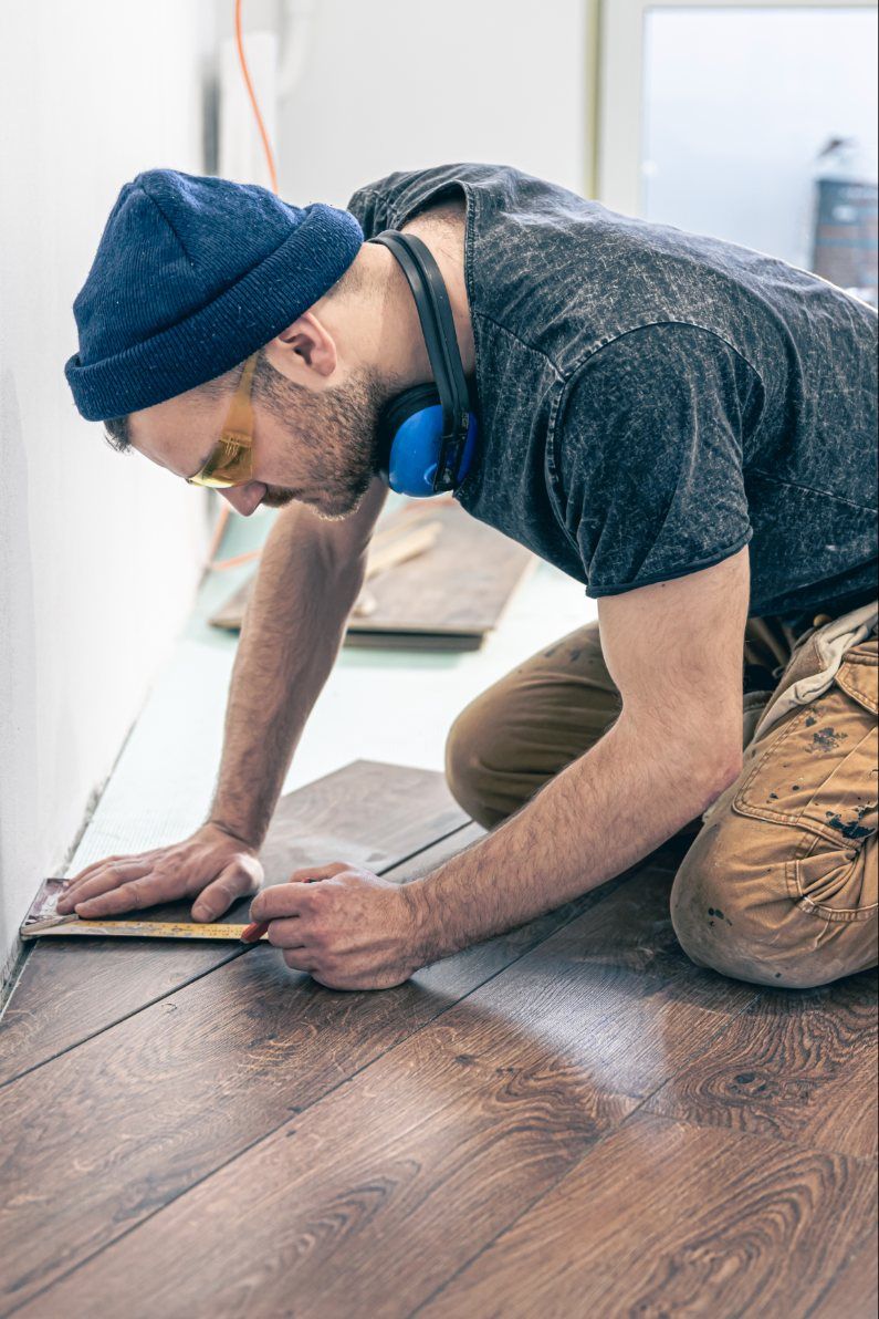 Installing new hardwood-look flooring during a renovation, Glen Cove NY